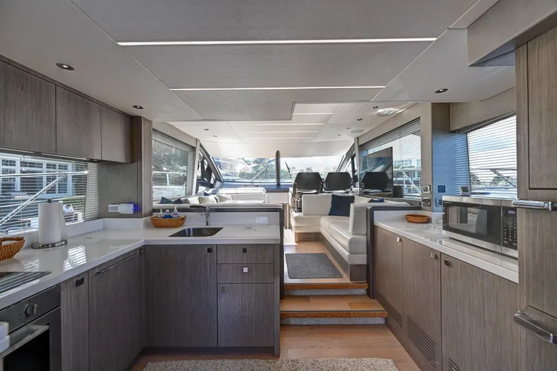 Slide: The Image of Luxurious interior of 2020 Sunseeker Manhattan 52 yacht with modern kitchen and seating area. - 18