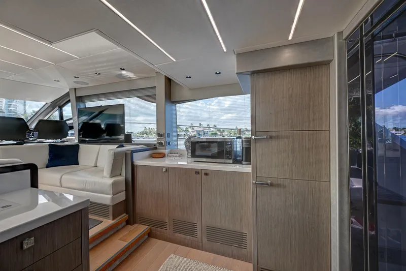 Slide: The Image of Luxurious interior of 2020 Sunseeker Manhattan 52 yacht with modern kitchen and seating area. - 19