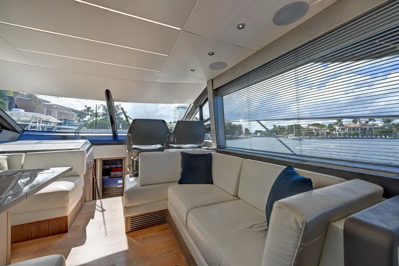 Slide: The Image of Luxurious interior of 2020 Sunseeker Manhattan 52 yacht with elegant seating and panoramic windows. - 23