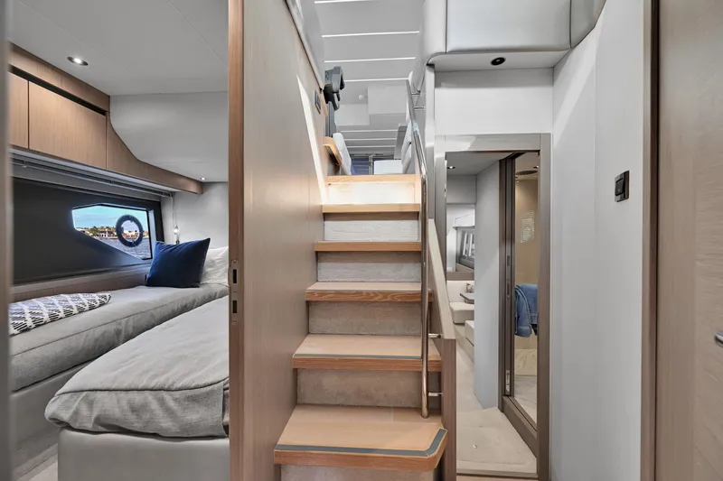 Slide: The Image of Luxurious interior of 2020 Sunseeker Manhattan 52 yacht with modern staircase and cozy cabin. - 27