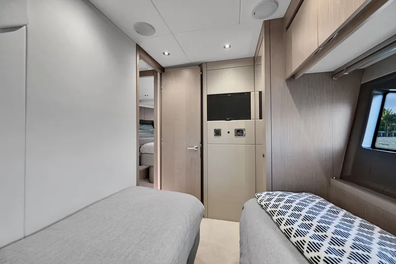 Slide: The Image of Interior of 2020 Sunseeker Manhattan 52 yacht, featuring modern twin cabin design. - 30