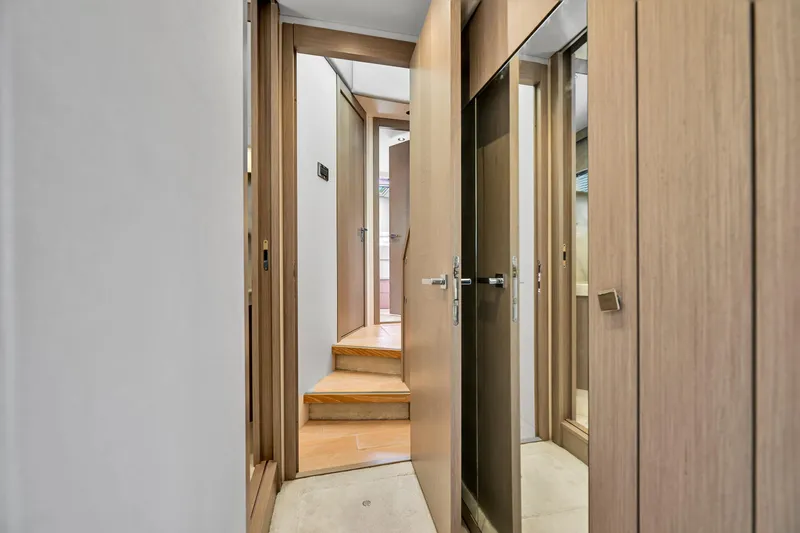 Slide: The Image of Interior hallway of 2020 Sunseeker Manhattan 52 yacht with wooden doors and steps. - 35