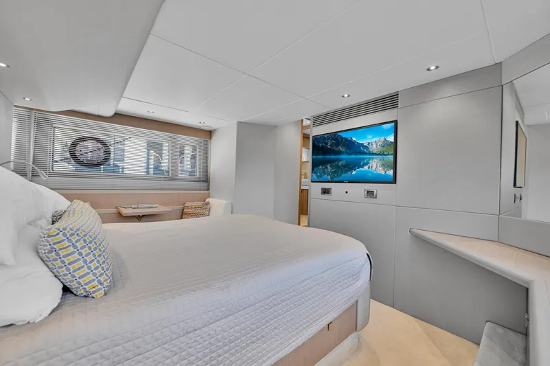 Slide: The Image of Luxurious Sunseeker Manhattan 52 yacht bedroom interior, featuring modern design and a large TV, 2020 model. - 42