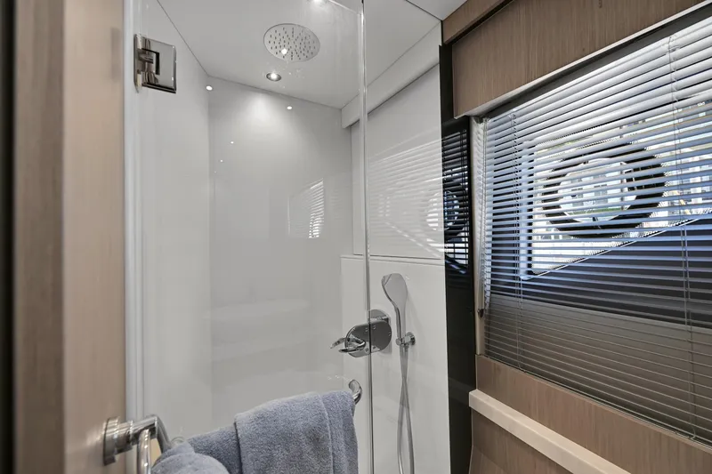 Slide: The Image of Luxurious bathroom in 2020 Sunseeker Manhattan 52 yacht with modern shower and window blinds. - 45