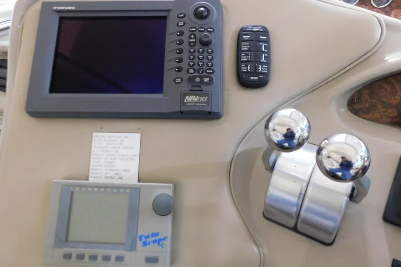 Slide: The Image of Control panel of a 1998 Sea Ray 540 Sundancer yacht with navigation equipment. - 14