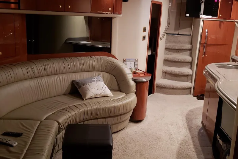 Slide: The Image of Luxurious interior of 1998 Sea Ray 540 Sundancer yacht with plush seating and elegant design. - 19