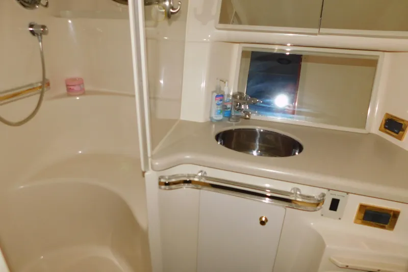 Slide: The Image of Bathroom interior of 1998 Sea Ray 540 Sundancer yacht with sink and shower. - 25