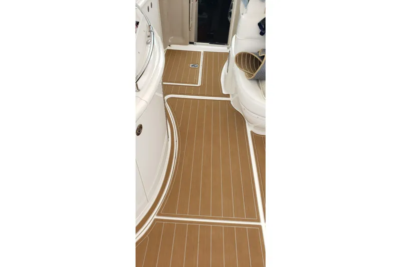 Slide: The Image of 1998 Sea Ray 540 Sundancer interior with sleek wooden flooring. - 3