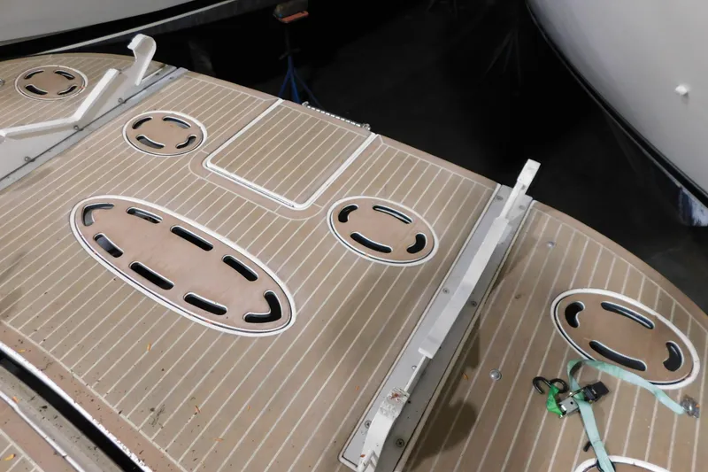 Slide: The Image of 1998 Sea Ray 540 Sundancer swim platform with teak decking and oval hatches. - 30