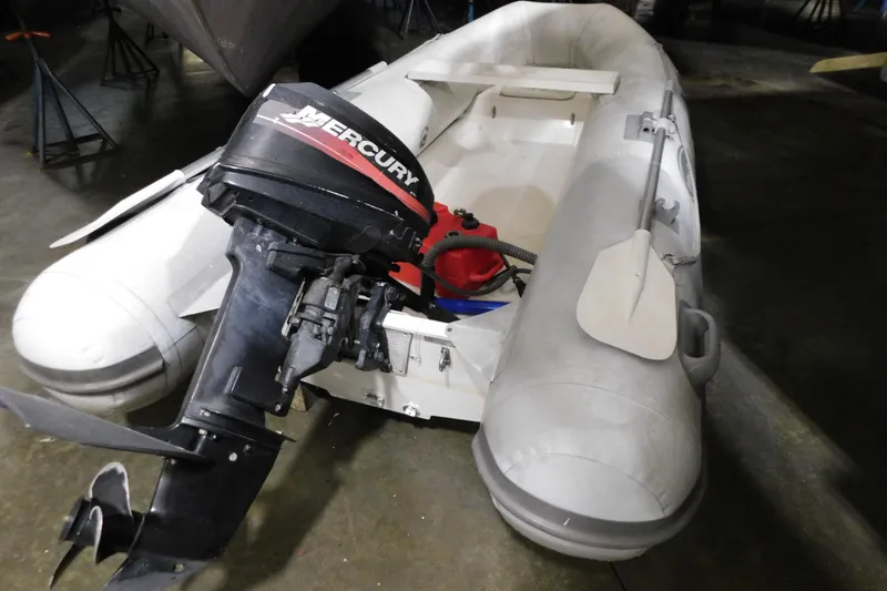 Slide: The Image of Inflatable boat with Mercury outboard motor, associated with 1998 Sea Ray 540 Sundancer. - 32