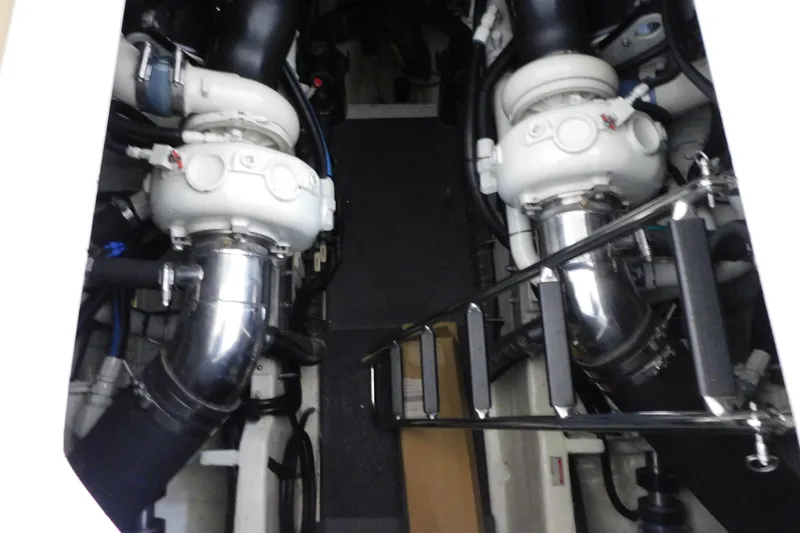 Slide: The Image of Engine room of 1998 Sea Ray 540 Sundancer with visible components and ladder. - 33