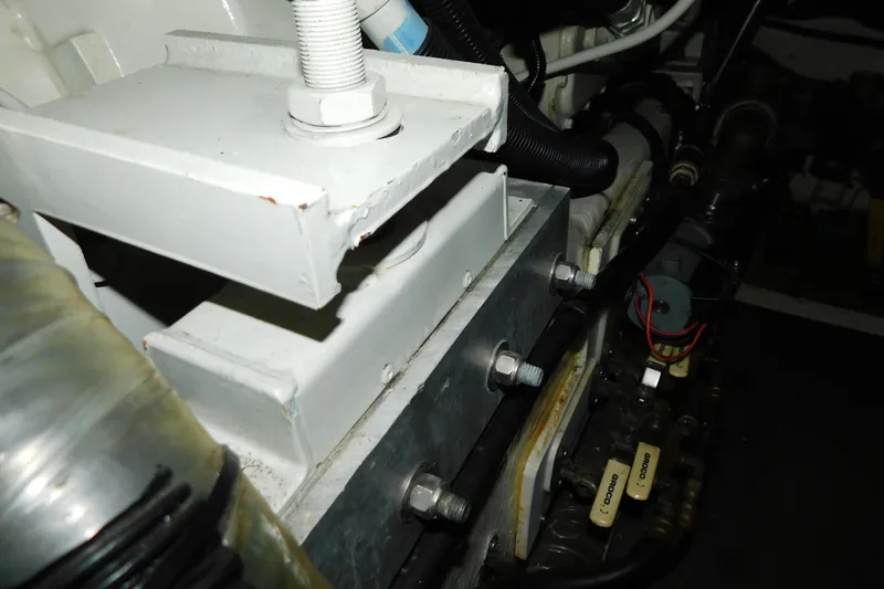 Slide: The Image of Engine compartment of a 1998 Sea Ray 540 Sundancer, showcasing mechanical components and wiring. - 35