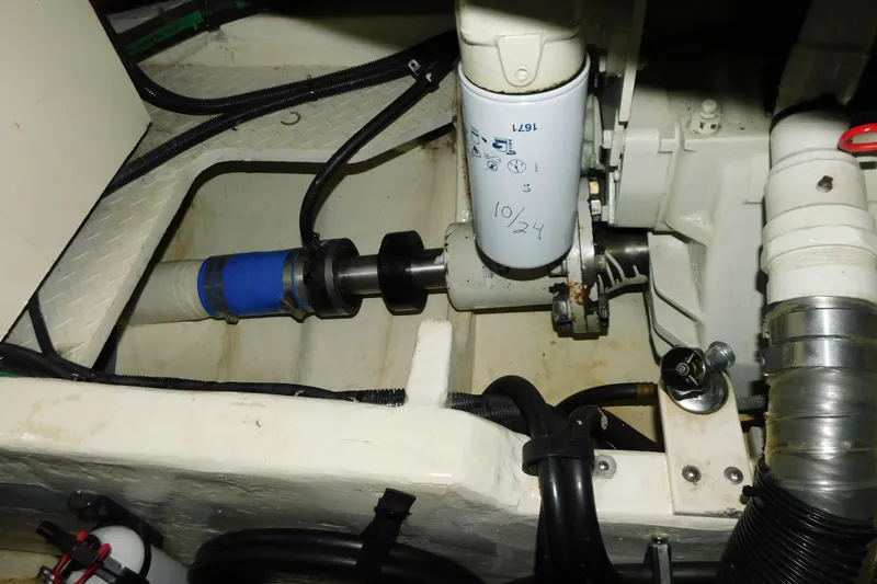 Slide: The Image of Engine compartment of 1998 Sea Ray 540 Sundancer with visible filter and components. - 39