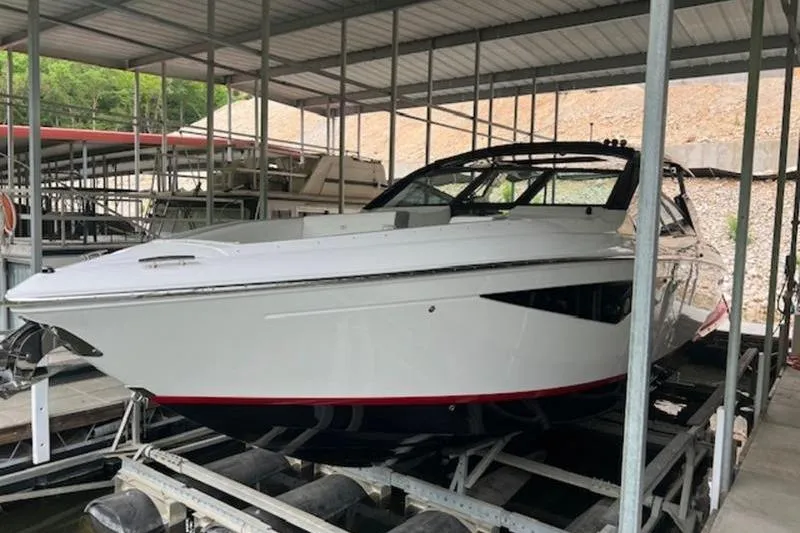 Slide: The Image of Helm of 2021 Cobalt A36BR boat with modern steering wheel and dashboard. - 2