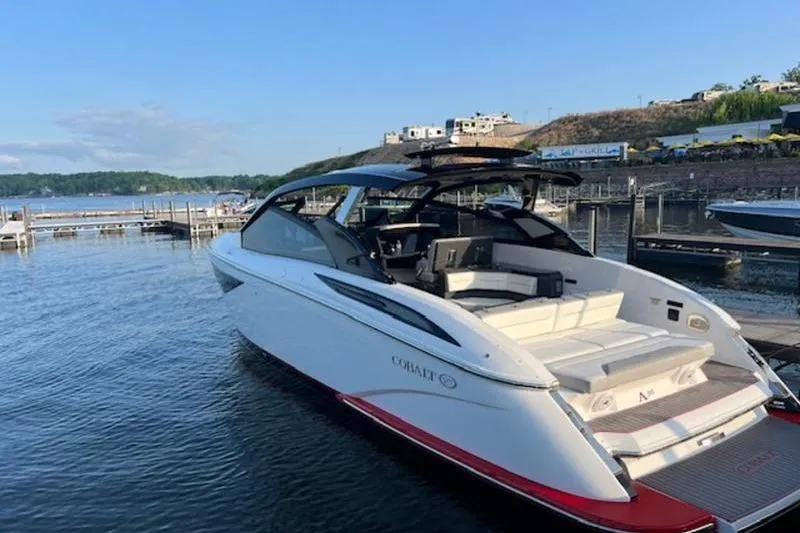 Slide: The Image of 2021 Cobalt A36BR boat docked in a covered marina. - 3