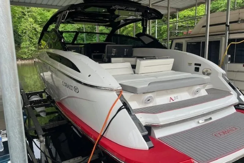 Slide: The Image of 2021 Cobalt A36BR boat docked, featuring sleek design and spacious seating. - 7