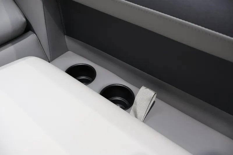 Slide: The Image of Interior of 2026 Premier 200 Sunscape RF with cup holders and seatbelt detail. - 18