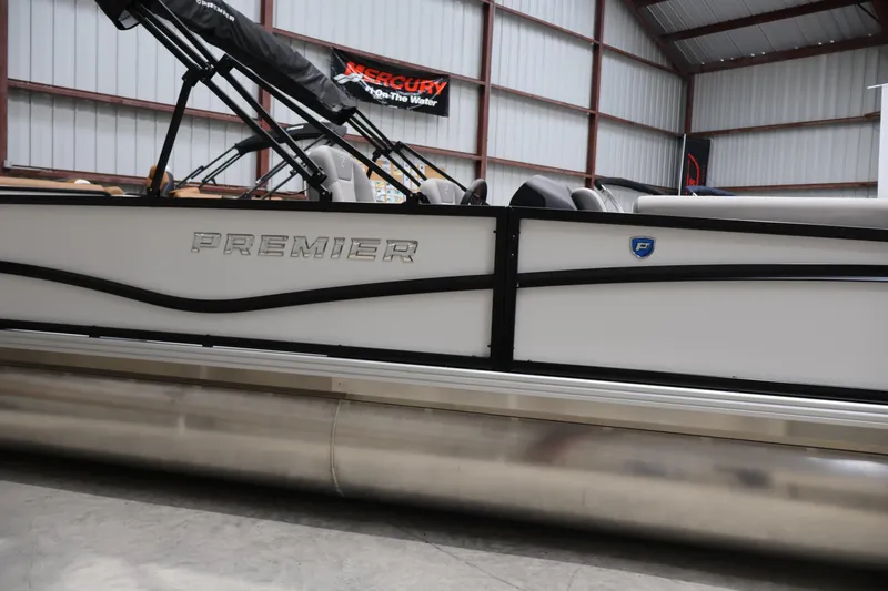 Slide: The Image of 2026 Premier 200 Sunscape RF pontoon boat in a warehouse setting. - 8