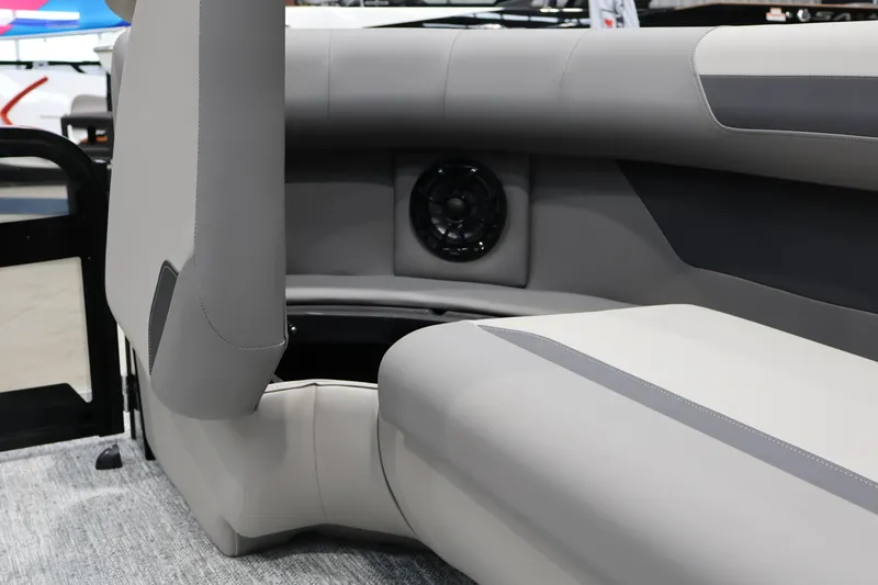 Slide: The Image of Interior seating of 2026 Premier 200 Sunscape RF boat, featuring sleek design and integrated speaker. - 25