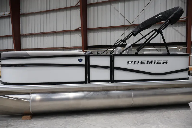 Slide: The Image of 2026 Premier 200 Sunscape RF pontoon boat in a warehouse setting. - 1