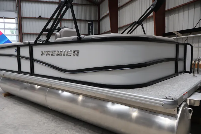 Slide: The Image of 2026 Premier 200 Sunscape RF pontoon boat in a warehouse setting. - 2