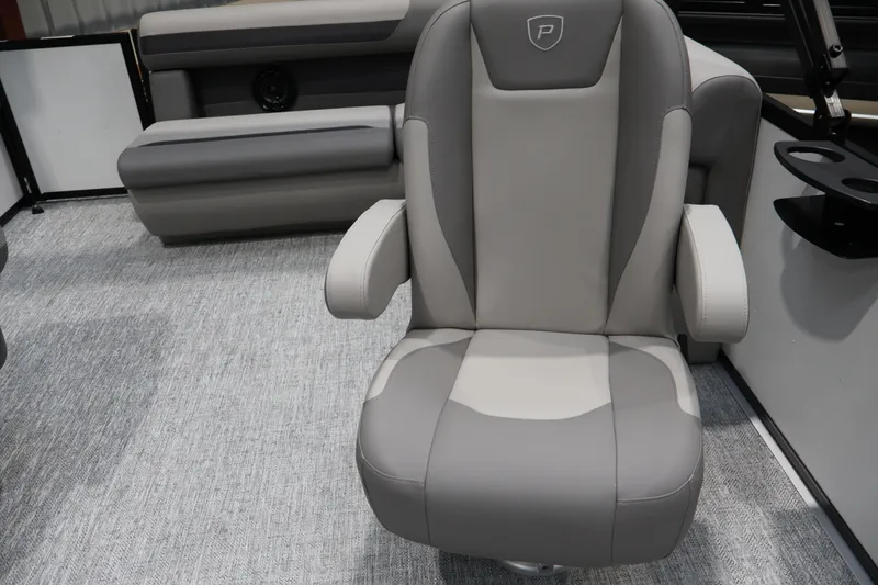 Slide: The Image of Premier 200 Sunscape RF 2026 boat interior with gray captain's chair and seating. - 36
