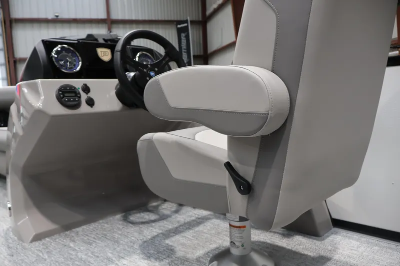 Slide: The Image of Captain's chair and dashboard of 2026 Premier 200 Sunscape RF boat in a showroom. - 29