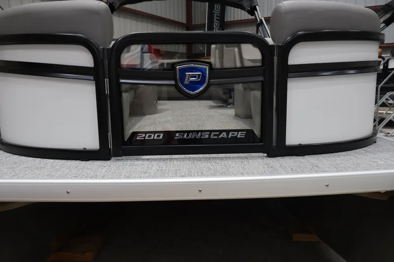 Slide: The Image of 2026 Premier 200 Sunscape RF pontoon boat front view in a showroom. - 7