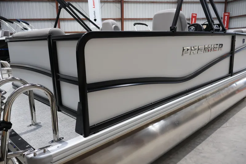 Slide: The Image of 2026 Premier 200 Sunscape RF pontoon boat, sleek design, side view in showroom. - 5