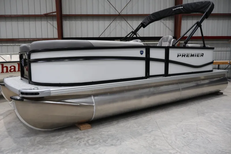 The Image of 2026 Premier 200 Sunscape RF pontoon boat in a warehouse setting. - 0