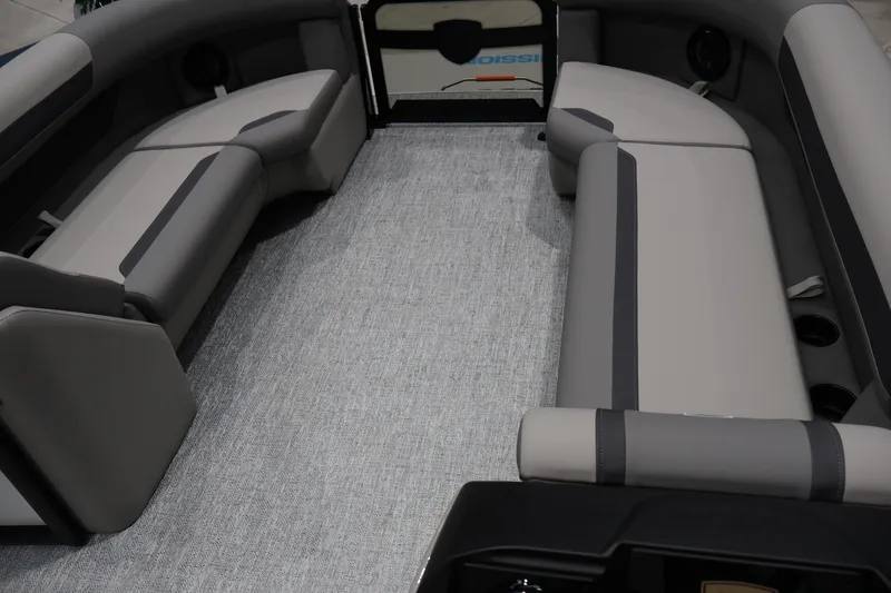 Slide: The Image of Interior of 2026 Premier 200 Sunscape RF pontoon boat with gray seating and carpet. - 38