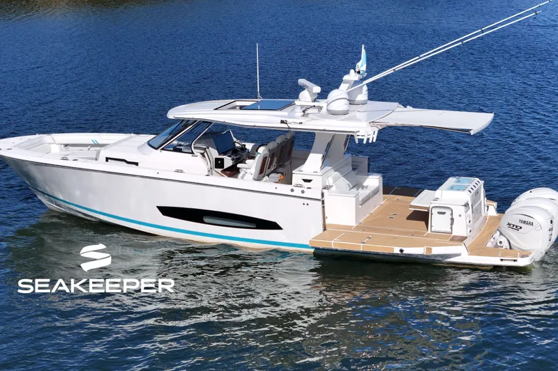 The Image of 2025 Regal 43 SAV boat on water, featuring Seakeeper stabilization and Yamaha engines. - 0