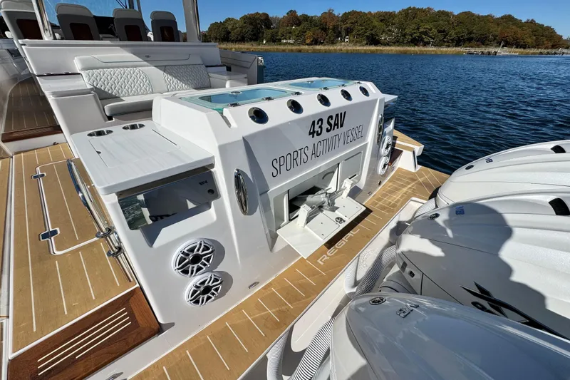 Slide: The Image of 2025 Regal 43 SAV Sports Activity Vessel on water, showcasing luxury deck and powerful engines. - 18