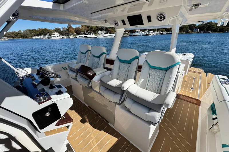 Slide: The Image of Luxurious interior of 2025 Regal 43 SAV boat with plush seating and modern controls. - 25