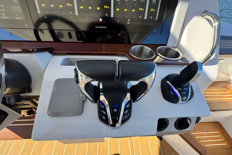 Slide: The Image of Control panel of 2025 Regal 43 SAV boat with Garmin display and joystick controls. - 29