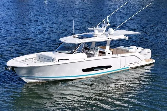 Slide: The Image of 2025 Regal 43 SAV luxury boat on calm water, showcasing sleek design and modern features. - 3