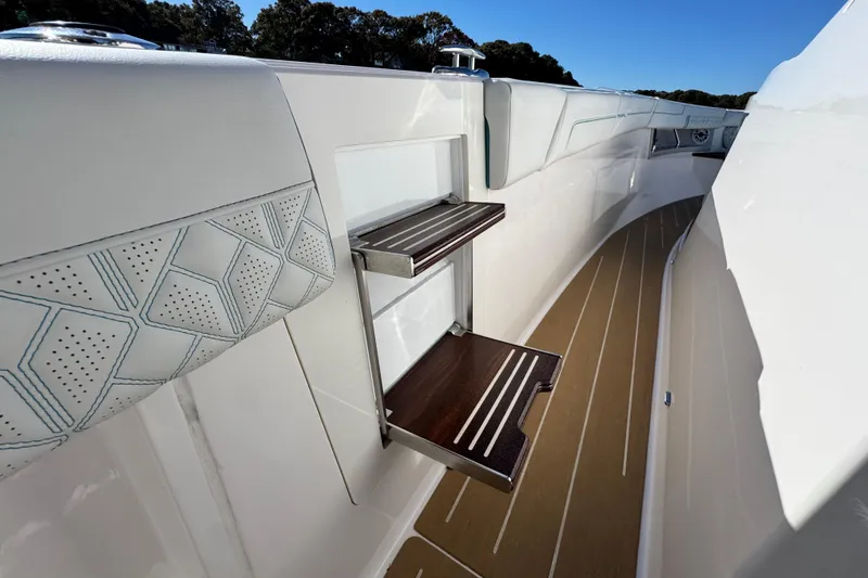 Slide: The Image of 2025 Regal 43 SAV yacht with elegant deck and foldable steps. - 30