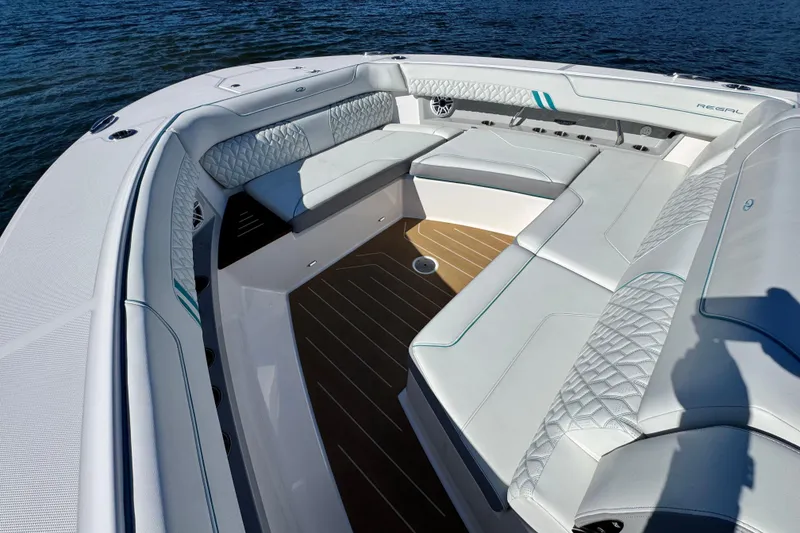 Slide: The Image of Luxurious seating area on 2025 Regal 43 SAV boat, featuring elegant white upholstery. - 33