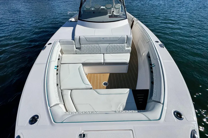 Slide: The Image of Luxurious 2025 Regal 43 SAV boat interior with elegant seating on calm water. - 35