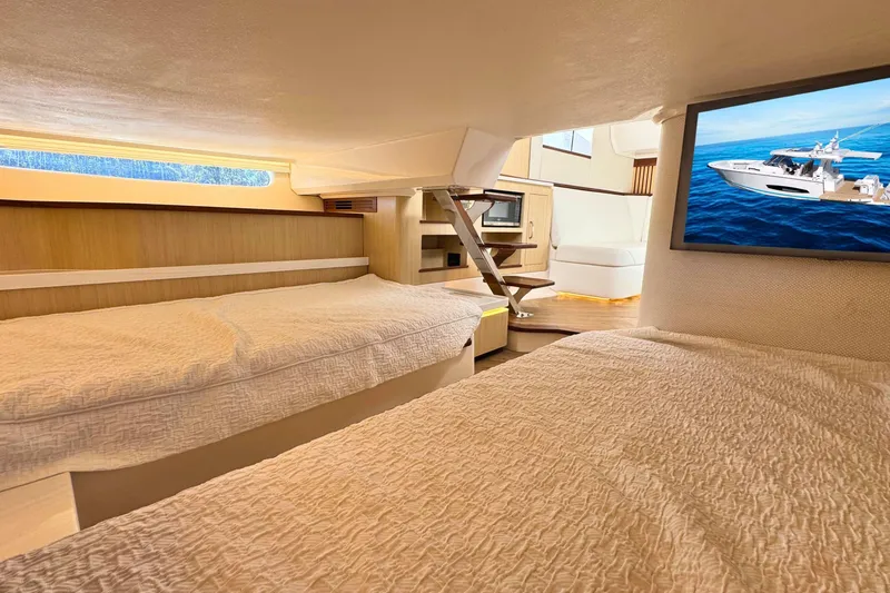 Slide: The Image of Interior of 2025 Regal 43 SAV yacht with cozy beds and modern amenities. - 44