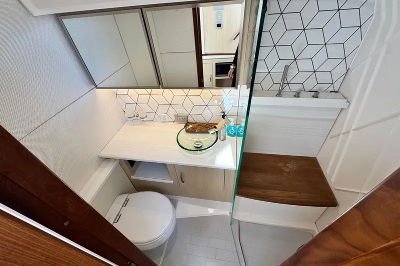 Slide: The Image of Modern bathroom in 2025 Regal 43 SAV yacht with sleek design and geometric tiles. - 46