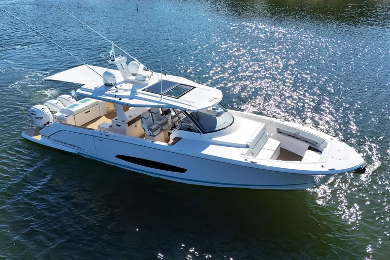 Slide: The Image of 2025 Regal 43 SAV luxury boat cruising on sparkling water. - 5