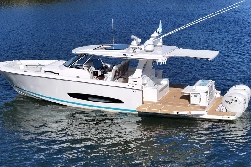 Slide: The Image of 2025 Regal 43 SAV luxury boat on water, featuring sleek design and modern amenities. - 6