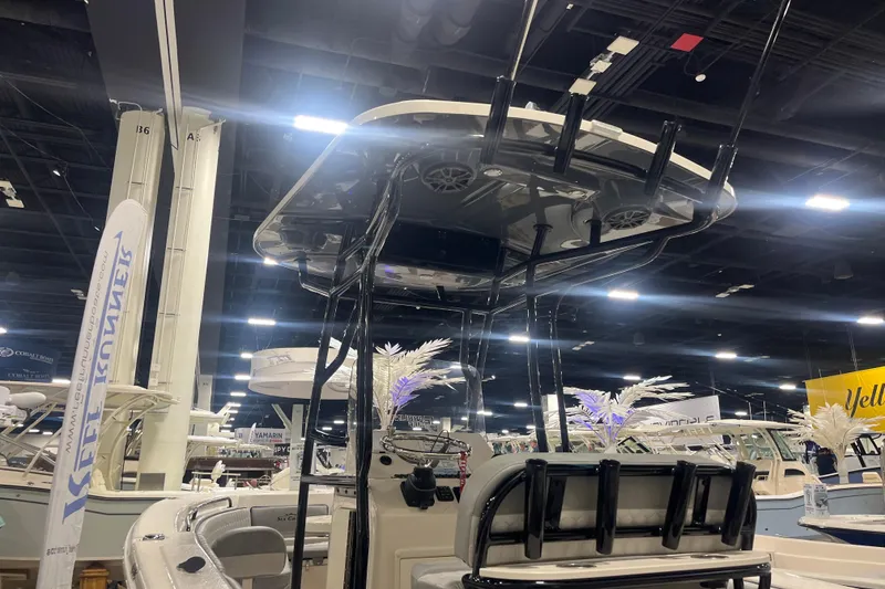 Slide: The Image of 2026 Sea Chaser 22 HFC boat displayed at an indoor boat show. - 5