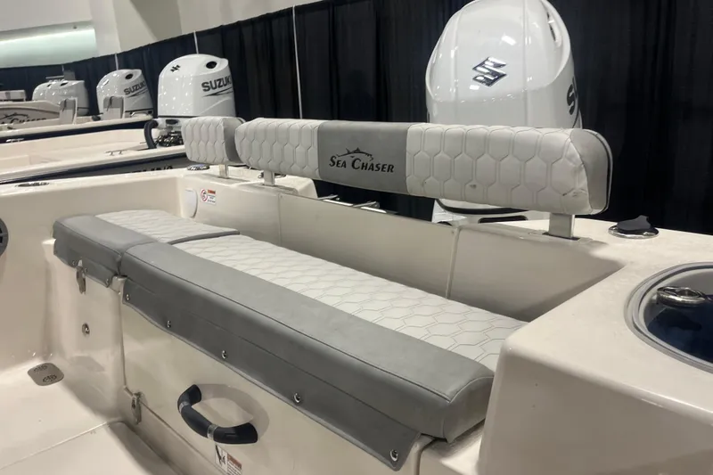 Slide: The Image of 2026 Sea Chaser 22 HFC boat interior with Suzuki engines, featuring cushioned seating. - 6