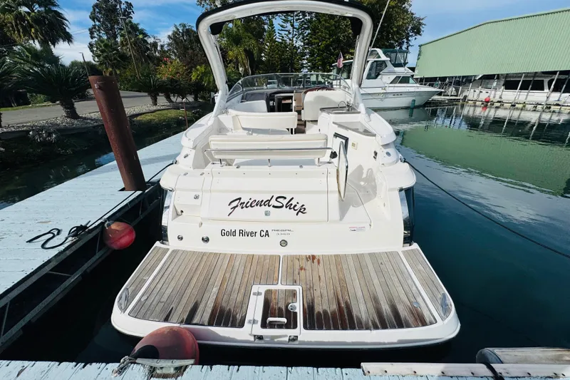 Slide: The Image of 2006 Regal 3360 Window Express boat docked, rear view, named "FriendShip," Gold River, CA. - 21