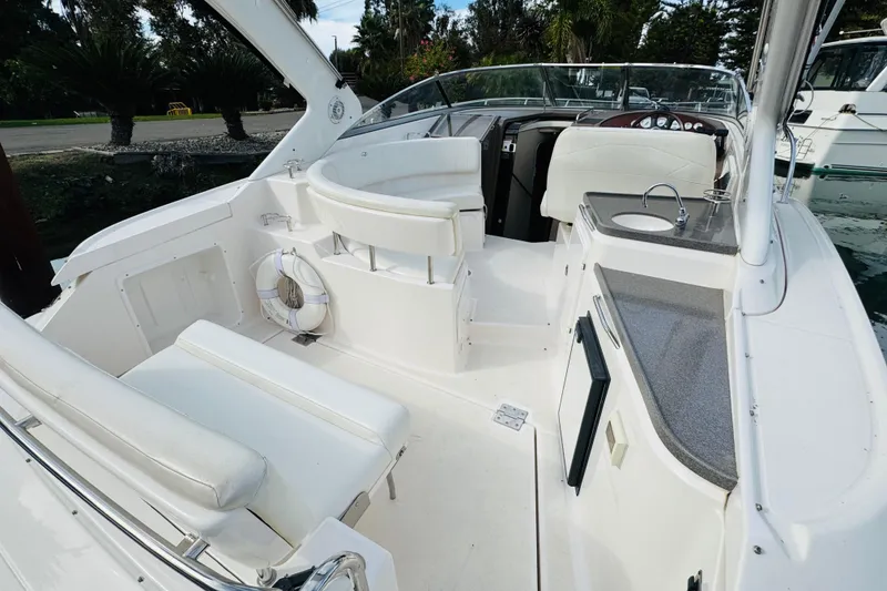 Slide: The Image of 2006 Regal 3360 Window Express boat interior with seating, sink, and life preserver. - 25