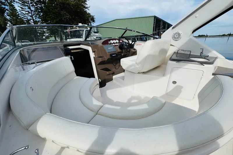 Slide: The Image of 2006 Regal 3360 Window Express boat interior with seating and helm. - 31
