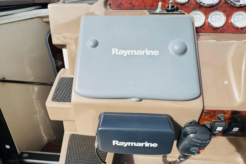 Slide: The Image of Control panel of 2006 Regal 3360 Window Express with Raymarine equipment. - 39