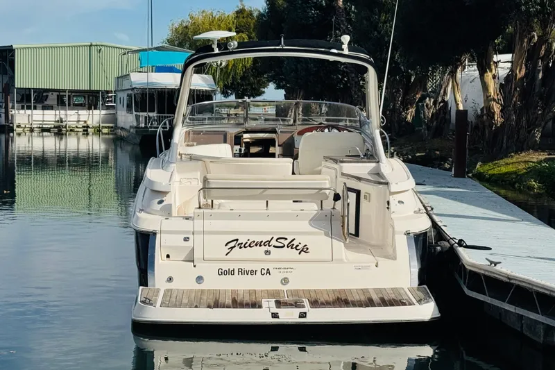 Slide: The Image of 2006 Regal 3360 Window Express boat docked at marina, rear view. - 5